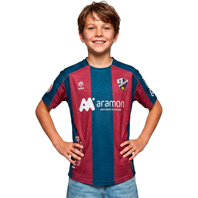 camiseta-soka-sd-huesca-primera-equipacion-nino-2026-2027-sdh-blue-sdh-red-0